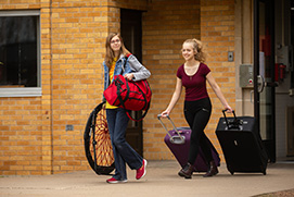 Students on campus on moving out day. Link to Gifts of Real Estate